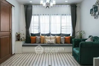 Charming living room with cozy seating and elegant decor, perfect for relaxation and entertaining.