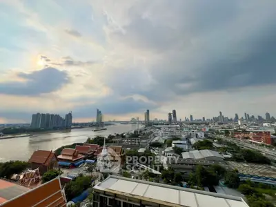 Stunning cityscape view with river and skyline, perfect for urban living enthusiasts.