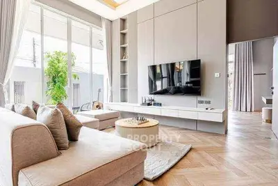 Luxurious modern living room with large windows and elegant decor