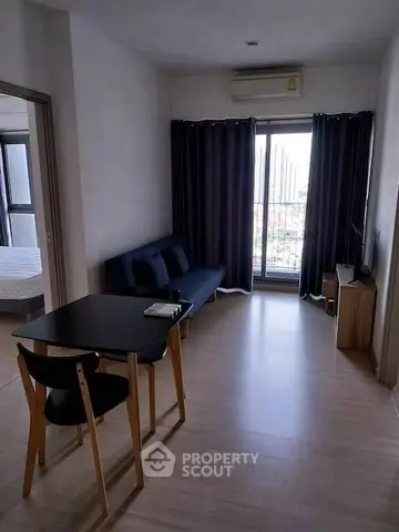Modern living room with balcony view and sleek furniture