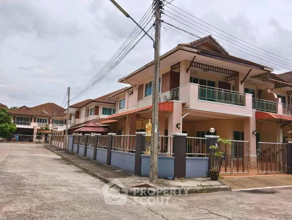Charming suburban townhouse with spacious balcony and modern design in a peaceful neighborhood.