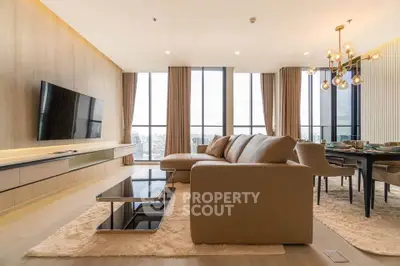 Luxurious modern living room with panoramic city views and elegant furnishings.