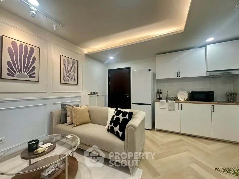 Modern living room with elegant decor and open kitchen layout