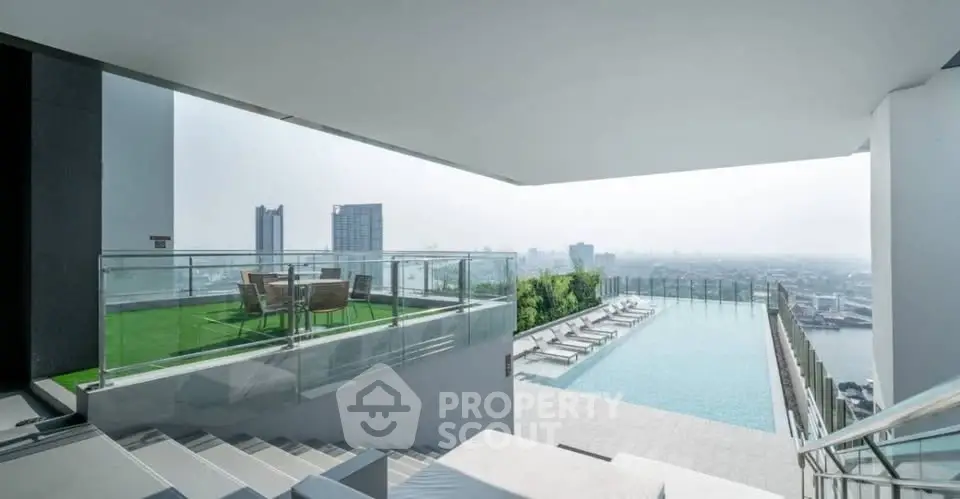 Luxurious rooftop pool with stunning city views and modern seating area.