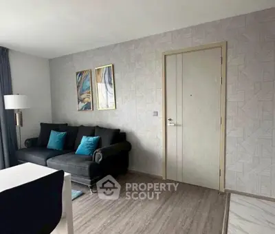 Modern living room with stylish decor and comfortable seating in a contemporary apartment.
