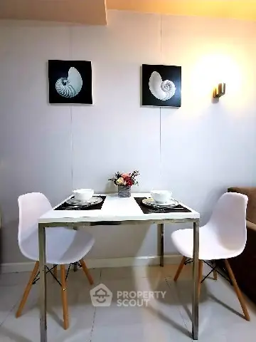 Chic dining area with modern decor and stylish seating in cozy apartment.