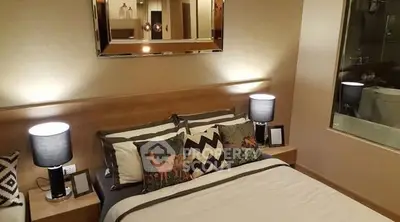 Cozy bedroom with stylish decor and ambient lighting, perfect for relaxation.