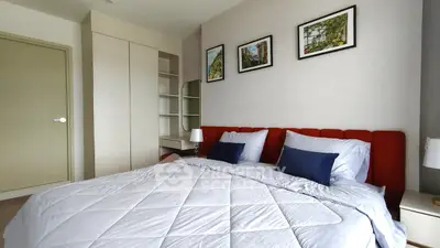 Modern bedroom with stylish decor and cozy bed in a contemporary apartment.