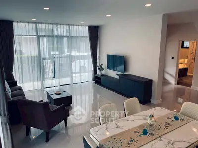 Spacious modern living room with elegant dining area and large windows