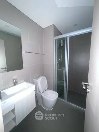 Modern bathroom with sleek design and glass shower enclosure