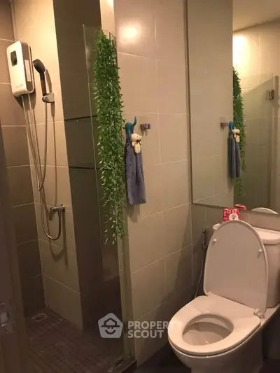 Modern bathroom with glass shower and sleek tile design