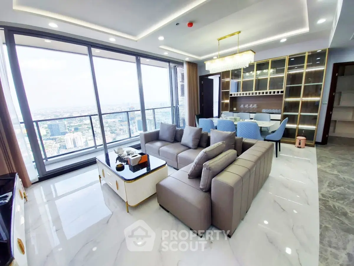 Luxurious high-rise living room with panoramic city views and elegant modern furnishings.