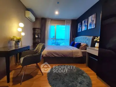 Luxurious bedroom with city view, elegant decor, and cozy ambiance.