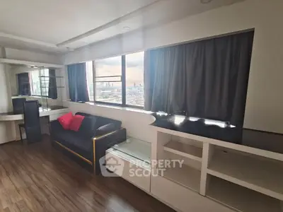 Spacious living room with city view and modern furnishings