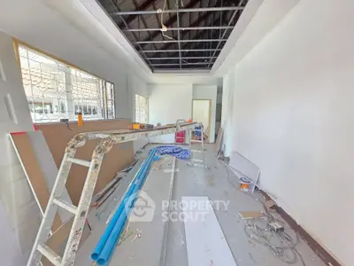 Spacious room under renovation with construction materials and tools