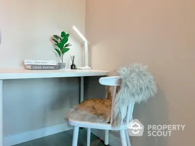 Cozy study nook with modern desk and stylish chair in elegant home interior.