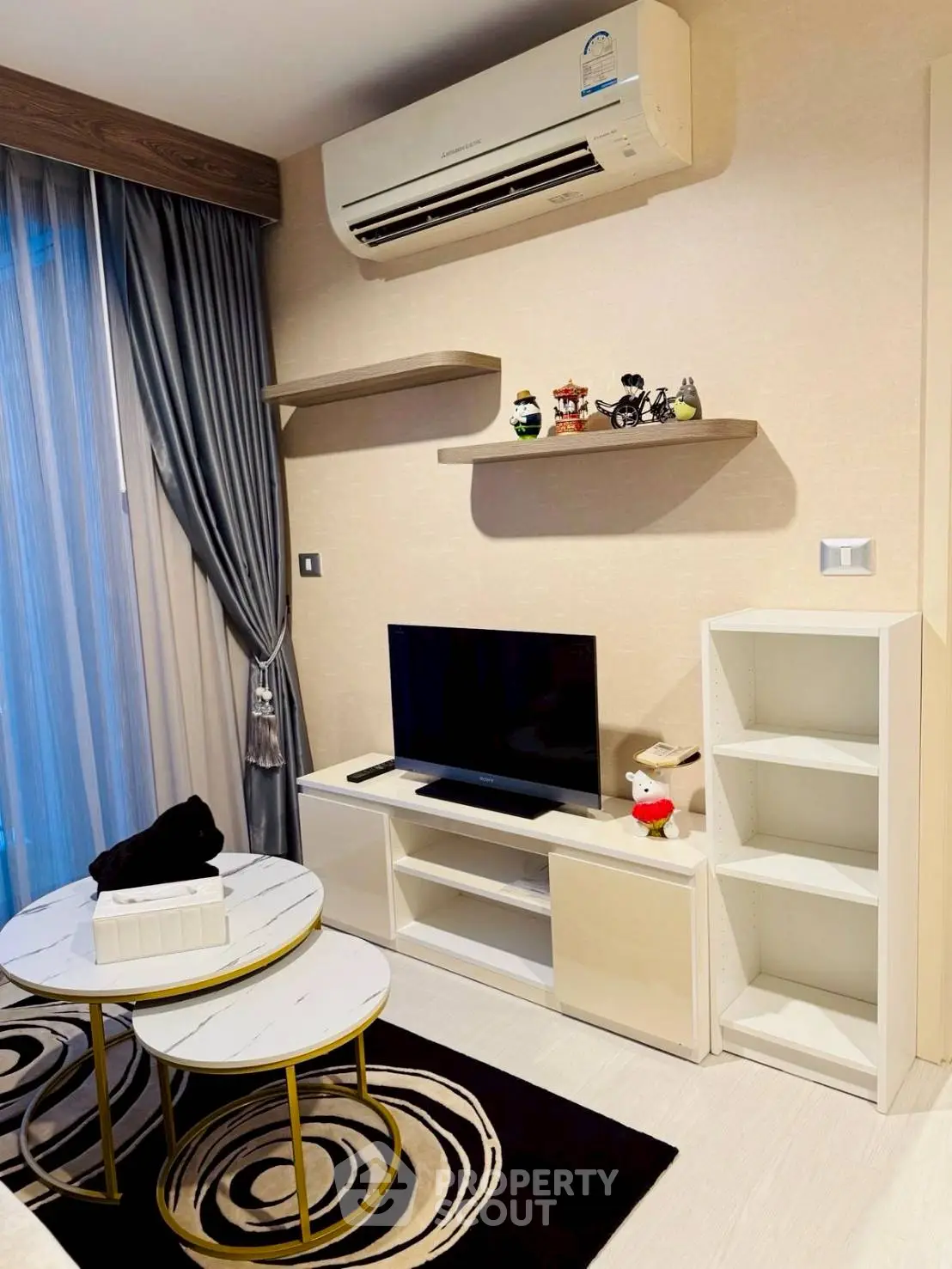 Modern living room with air conditioning and stylish decor
