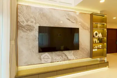 Luxurious living room with modern TV feature wall and elegant decor