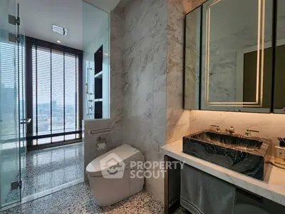 Luxurious modern bathroom with city view and elegant marble finishes