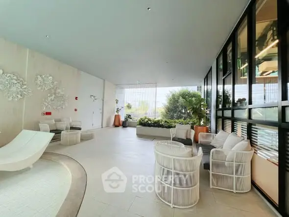 Luxurious modern living room with elegant seating and lush greenery