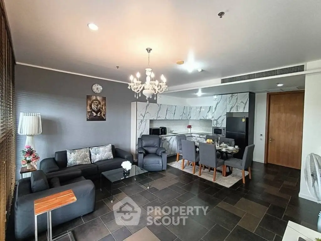 Spacious open-plan living room with modern kitchen and elegant decor