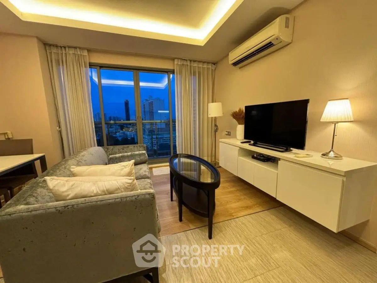 Modern living room with city view, stylish furniture, and ambient lighting.