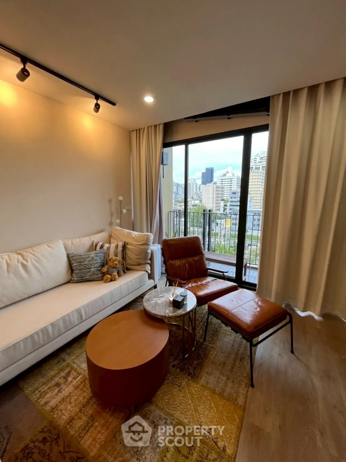 Modern living room with city view and stylish furniture