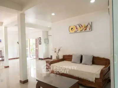 Spacious living room with elegant wooden furniture and modern decor