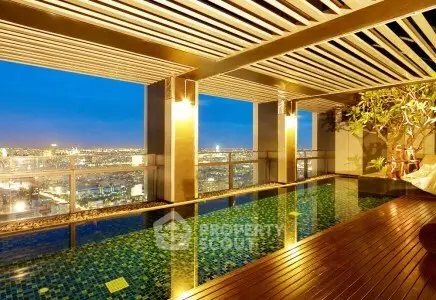Luxurious rooftop pool with stunning city skyline view at night