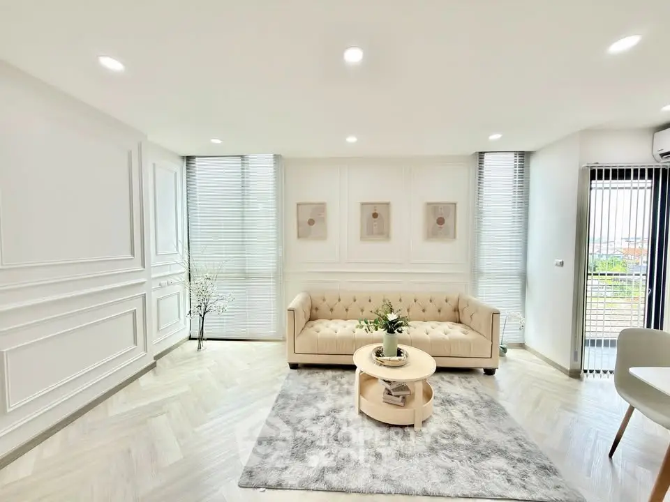 Elegant living room with modern decor and natural light, featuring a plush sofa and stylish coffee table.