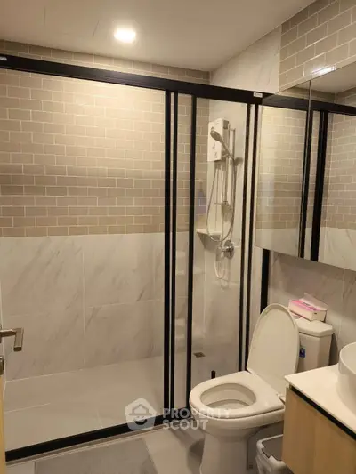 Modern bathroom with glass shower enclosure and sleek design