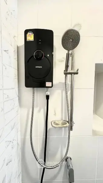 Modern bathroom with sleek shower system and white tiled walls