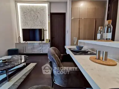 Modern living room with stylish decor and open kitchen layout