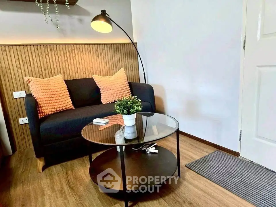 Cozy living room with modern sofa and stylish glass coffee table