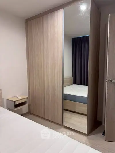 Modern bedroom with mirrored wardrobe and minimalist design