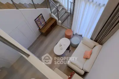 Modern duplex living room with stylish decor and cozy seating area