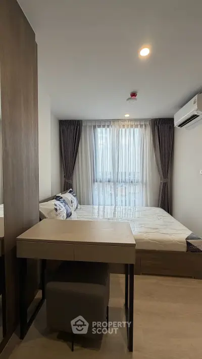Modern bedroom with stylish decor and natural light