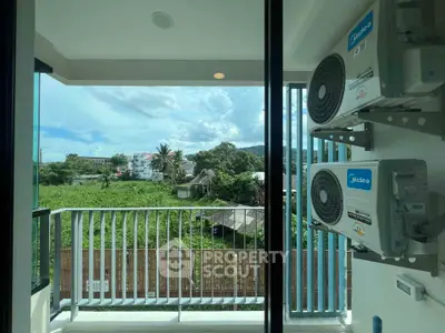 Modern balcony with scenic view and air conditioning units, perfect for relaxation and comfort.
