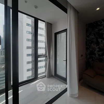 Modern apartment with floor-to-ceiling windows and city view