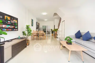 Spacious modern living room with open kitchen and stylish decor