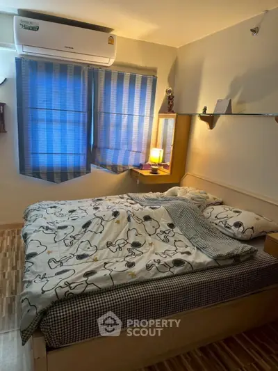 Cozy bedroom with stylish decor and comfortable bedding