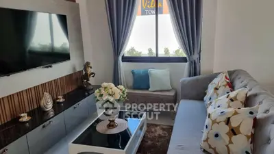Charming living room with modern decor, plush sofa, and elegant coffee table, perfect for cozy gatherings.