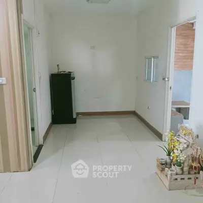 Spacious interior with tiled flooring and decorative elements, ideal for customization.