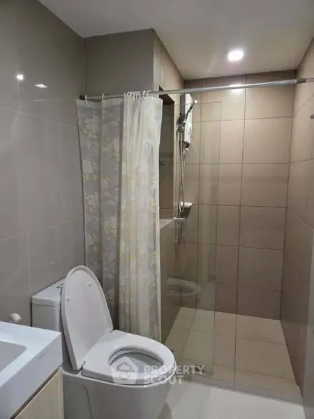 Modern bathroom with shower and toilet in sleek design