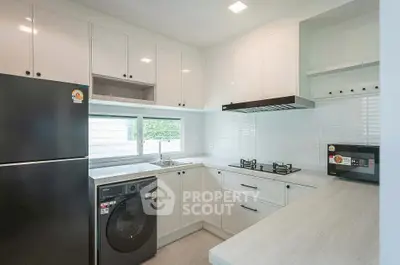 Modern kitchen with sleek appliances and open layout design