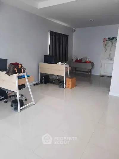 Spacious modern office space with sleek desks and minimalistic decor