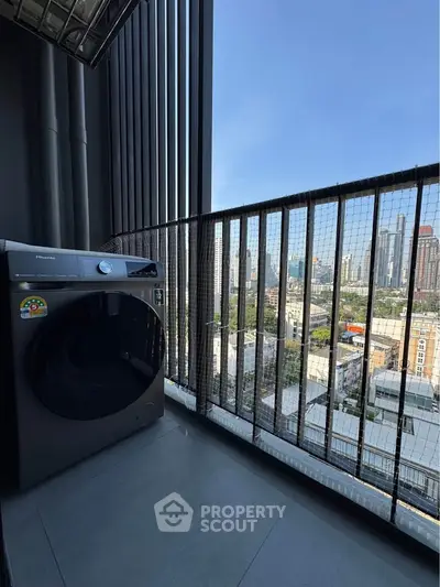 Modern balcony with city view and washing machine, perfect for urban living.