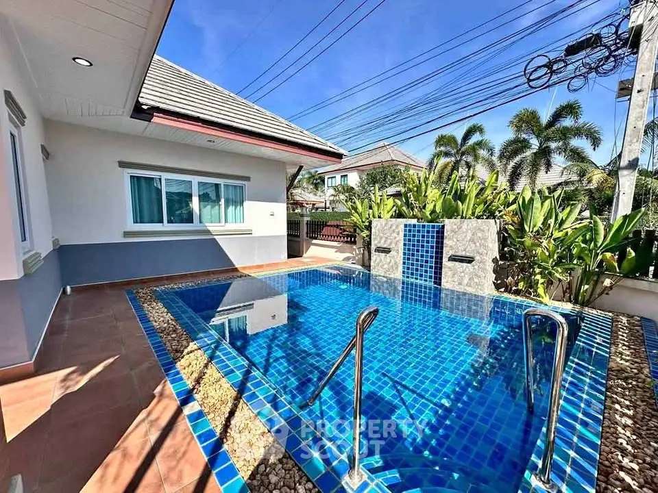 Stunning private pool area with modern design and lush greenery, perfect for relaxation and entertainment.