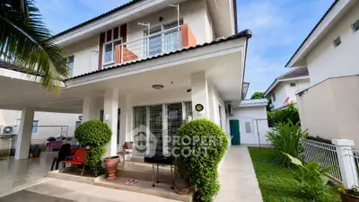 Charming two-story house with lush garden and spacious patio in a serene neighborhood.