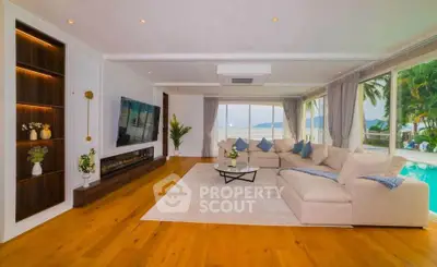 Luxurious living room with ocean view, spacious seating, and elegant decor